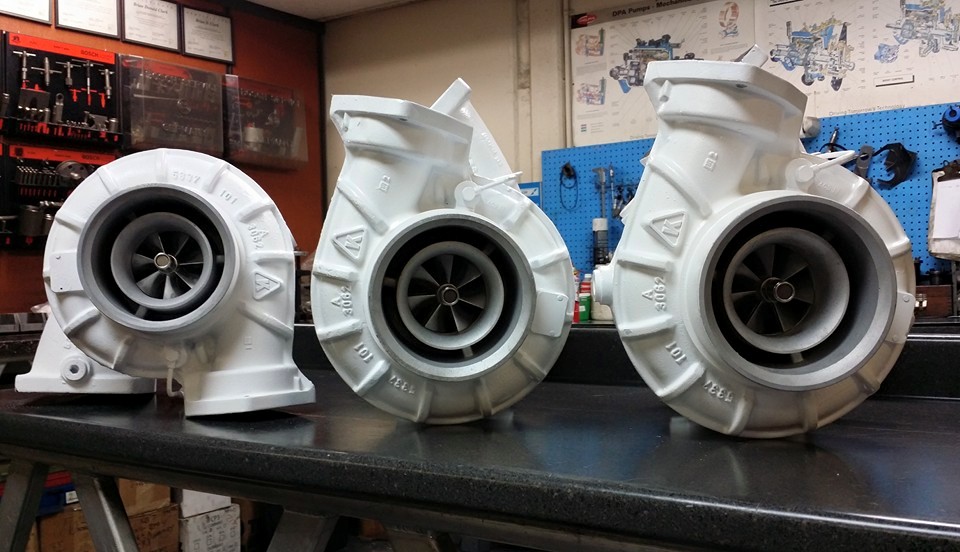 Group of assembled turbochargers on a work surface